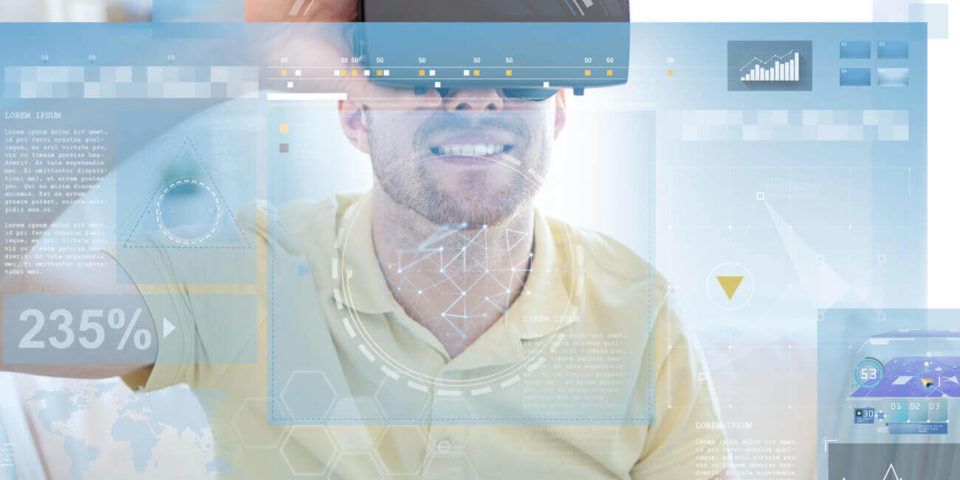 A person wearing a virtual reality headset interacting with a data visualization projected onto a screen.
